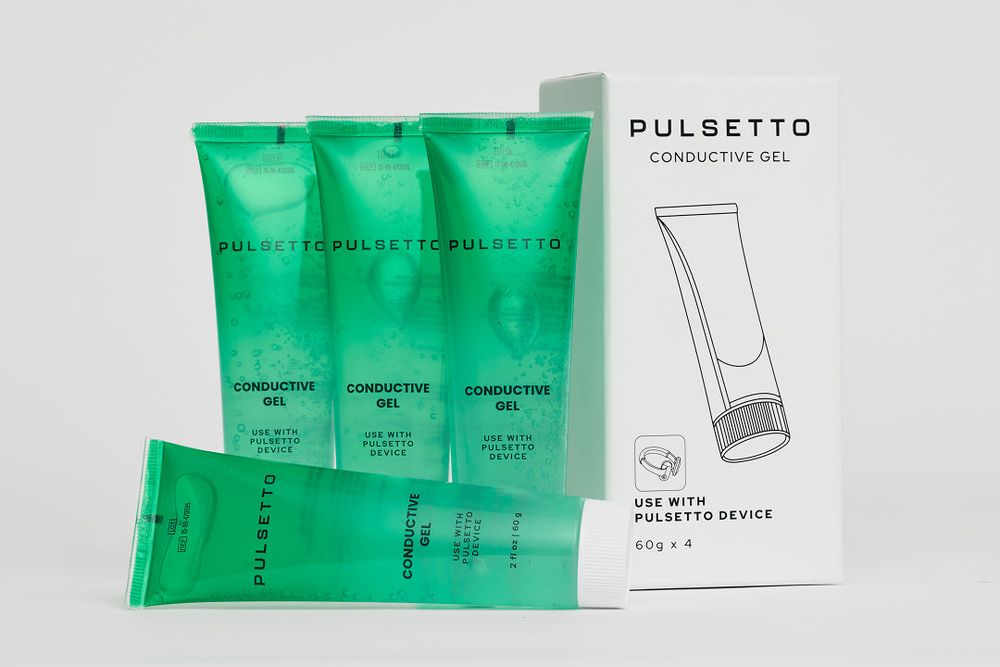 Four tubes of Pulsetto conductive gel standing beside the refill carton marked 60 g by four